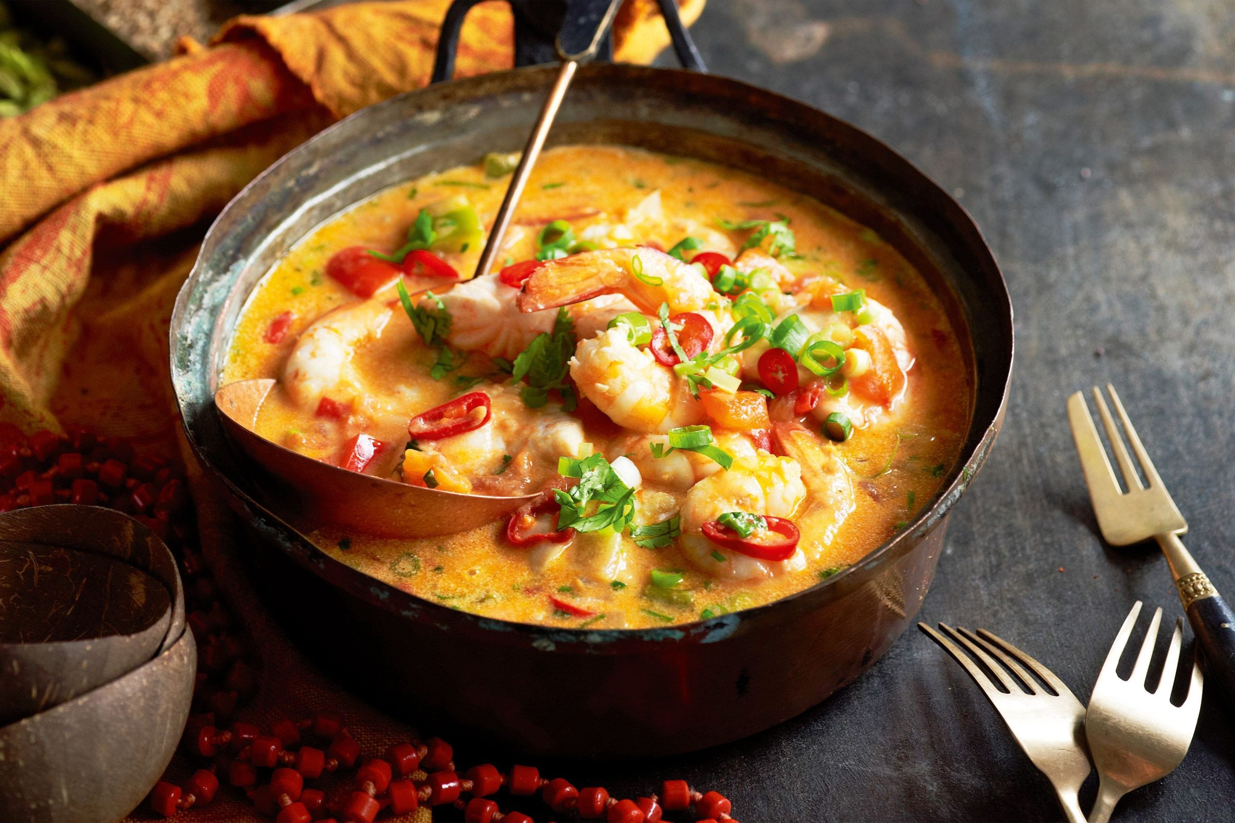 Moqueca — the fish stew that carries a whole coast in a clay pot.